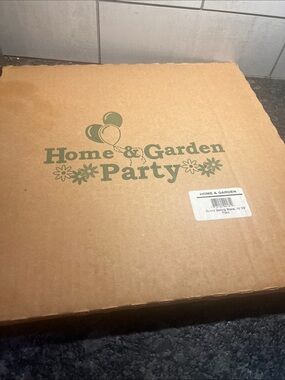 Home & Garden Party 14 1/2” new in box round pizza stone.